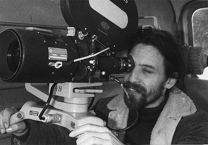 Roy shooting in a helicopter